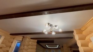 Установка натяжных потолков с деревянными балками