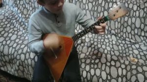 Игра на балалайке