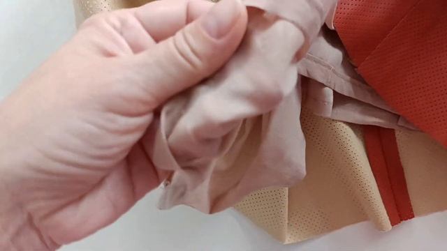 Сарафан из искусственной перфорированной кожи.