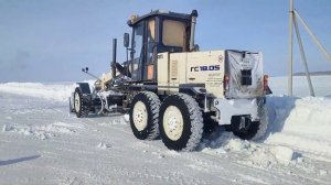 На расчистке снега.Автогрейдер ГС18.05