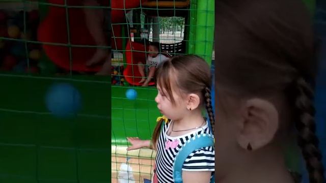 Моя девочка ,наша Дашенька гуляет по игровому городку.
