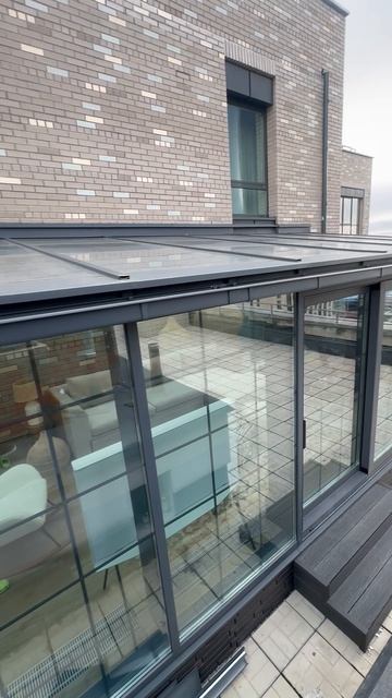 Зимний сад из алюминиевого профиля на крыше дома в Москве