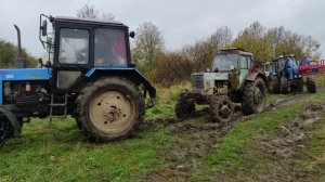 Тракторы МТЗ 82 и МТЗ 1221 спасают застрявший МАЗ.