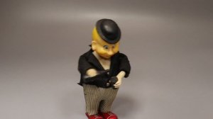 Старинная заводная игрушка «Клоун-выпивоха»