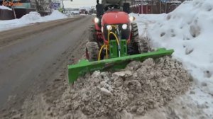 Работа минитрактора с отвалом