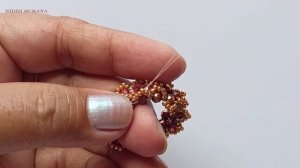 Сверкающий хрустальный кулон-пончик от Nidhi Surana