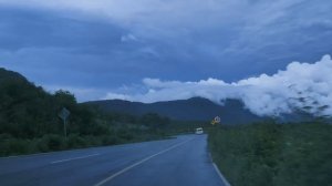 mixkit-going-down-a-curved-highway-through-a-mountain-range-41576-hd-ready