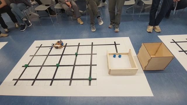 Видео 2 - Выполнение олимпиадного задания по переносу кубиков в зону с бортиком