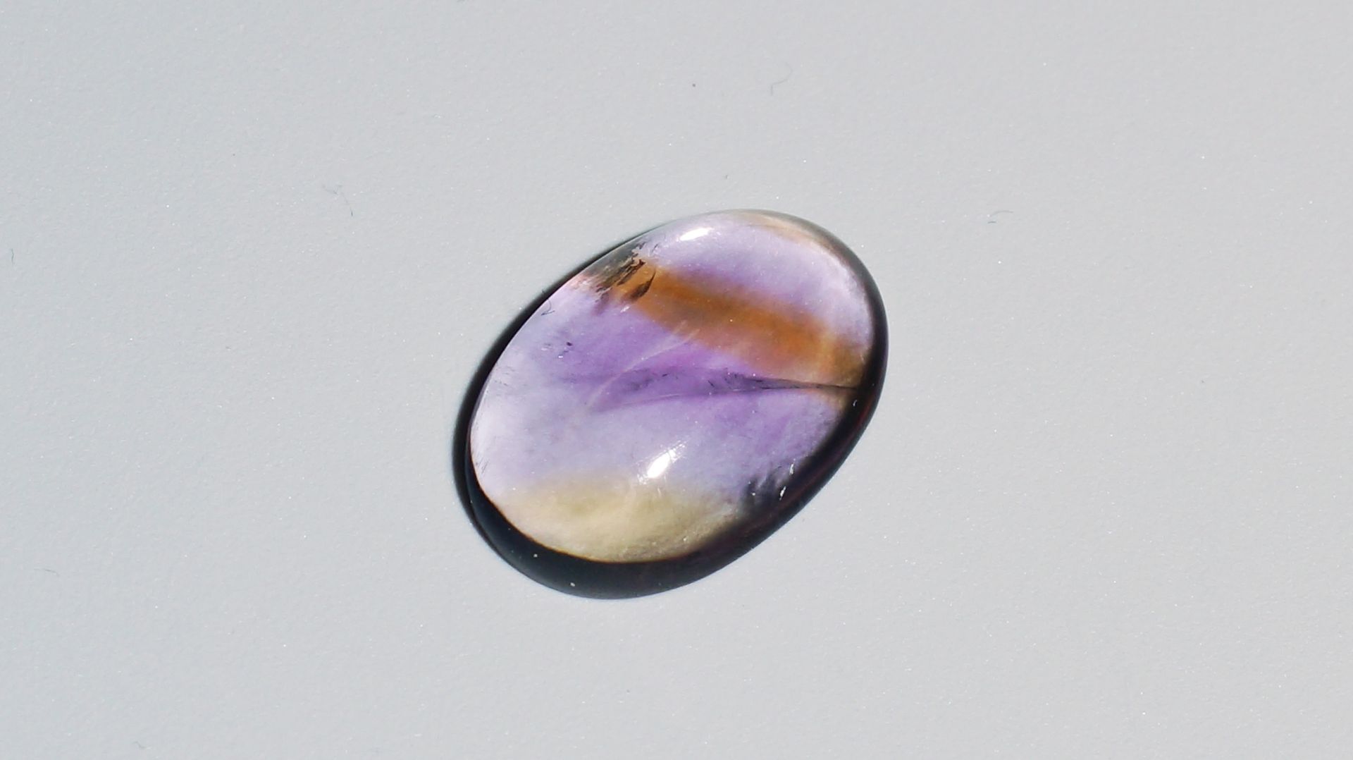 Аметрин Кабошон 7.04 карат смотреть онлайн