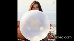Girls blow plastic bag and balloon