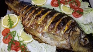 Карп в духовке, фаршированный шампиньонами, луком и морковью