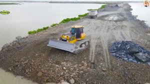 Строительство, дорога на озере . засыпка