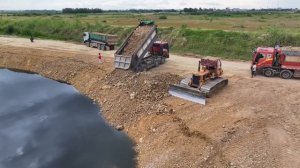 Be LandSlide!!Crazy Hard Work Of Bulldozer Pushing Stones Bury The Side Of Lake With 25T Dump Truck