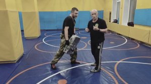 От удара ножом в живот. В.Н. Крючков