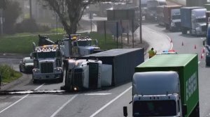На трассе перевернулся трак с контейнером.