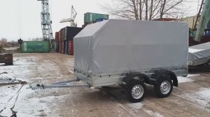 Двухосный прицеп «Коммунист» с трапом для заезда техники.