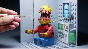 Фигурка мутанта LEGO-человечка в лаборатории. Диорама из полимерной глины и ПВХ пластика
