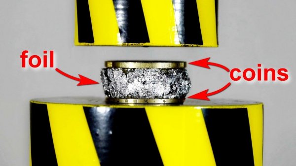 MAKING A COIN USING A HYDRAULIC PRESS