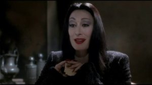 Anjelica Huston with long nails - Morticia Addams