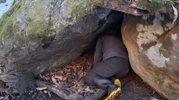 Winter Bushcraft Camping   Survival Shelter Between Two Rocks in Snowy Forest
