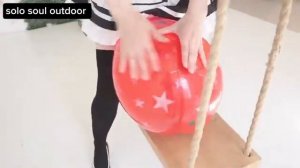 Looner girl playing with balloon
