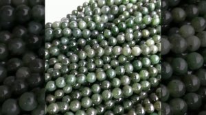 Нефрит Байкальский натуральный с включениями, трещинками, в том числе у дырочек круглых бусин