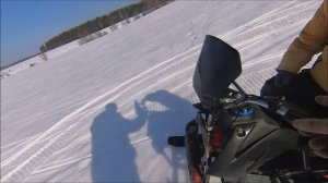 Женя на своём маленьком снегоходе