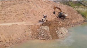 New road improvement! Rural road development using Komatsu Dozer to level land in local project .