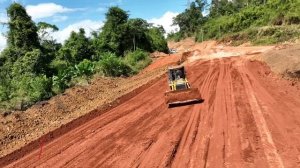 Wonderful Power Bulldozer LiuGong Pushing Red Dirt and Truck Unloading To Make Road On Mountain