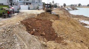 Extremely Road Construction Processing Bulldozer Pushing Soil Into Water Vs Dump Truck Dumping