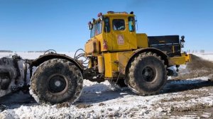 Грязь на дороге.К-700 разбивает последние сугробы.
