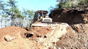 THE LOWER PART OF THE ROAD CONSTRUCTION INVOLVES A CLIFF AND A VERY NARROW FOREST ROAD WITH ACTION 2