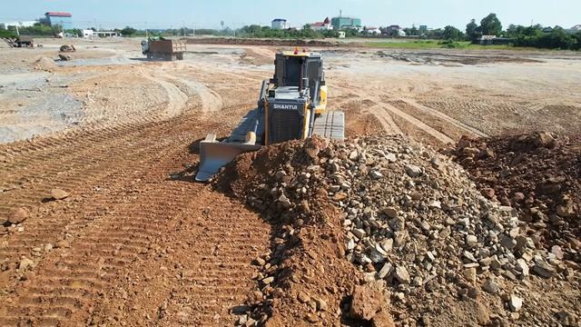 Wonderful SHANTUI DH17 C3 Bulldozer Pushing Soil Fill Deep Pit With Heavy Dump Truck Pouring
