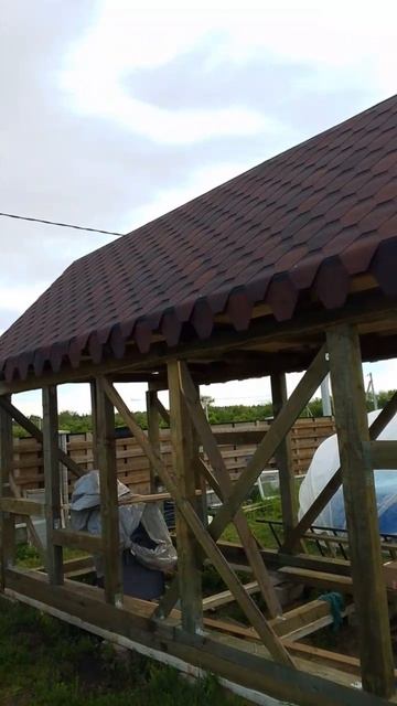 Накрыли крышу мягкой черепицей.