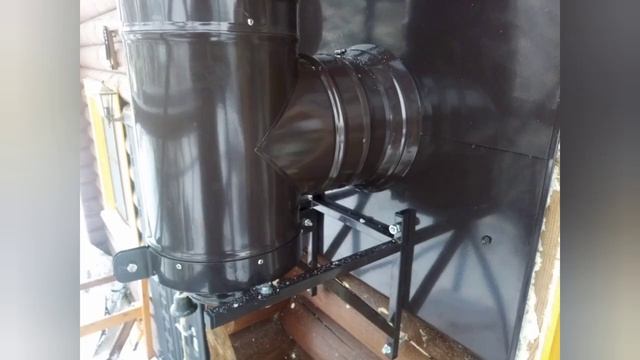 Дымоход в цвет кровли по фасаду.