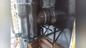 Дымоход в цвет кровли по фасаду.