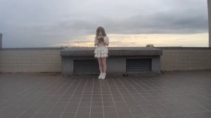 Kigurumi Doll in the white lolita dress walking on roof.
