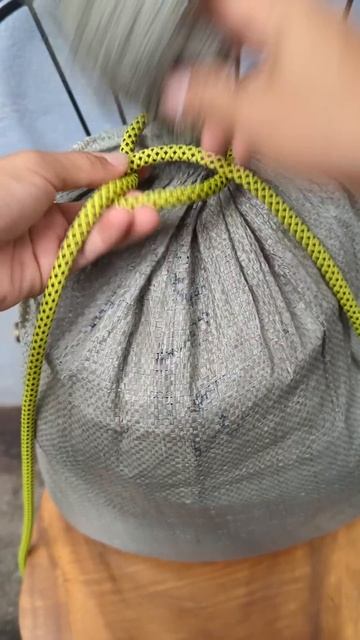 A common way to tie a good bag knot.