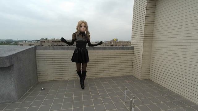 Kigurumi Doll In Rubber Dress Tries To Jump On Highheels.