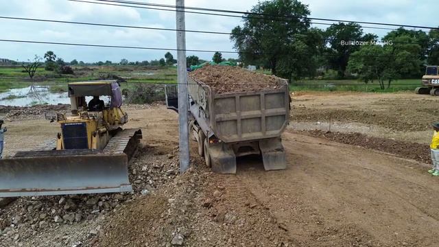 Incredible Heavy DumpTrucks Hauling Rock Unload Into Canal Builds A Dam With KOMATSU D53P Bulldozer