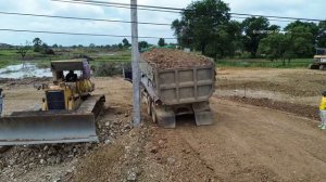 Incredible Heavy DumpTrucks Hauling Rock unload into Canal Builds a Dam with KOMATSU D53P Bulldozer
