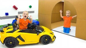 Крис спасает из коробки игрушечные машинки — пожарную машину, скорую помощь  и полицию