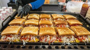 Мастер уличных тостов, фудтрак в Мёндоне, предлагающий гамбургеры и тосты — корейская уличная еда