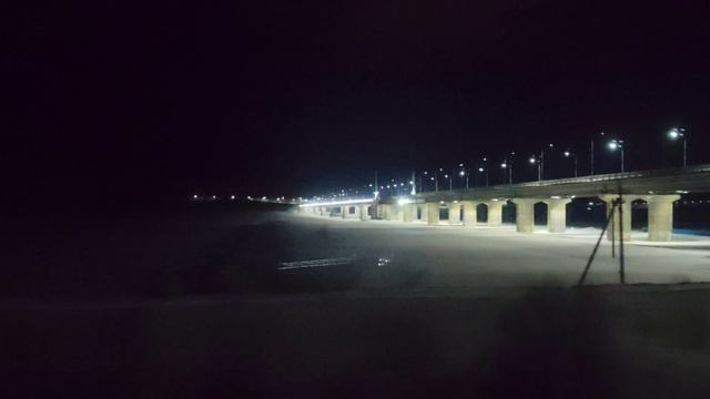 Мост через залив из окна поезда. Февраль 2026. Архив. Мурманск.