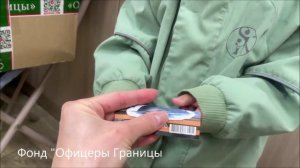 Константин бережно упаковывает подарки воинам на СВО