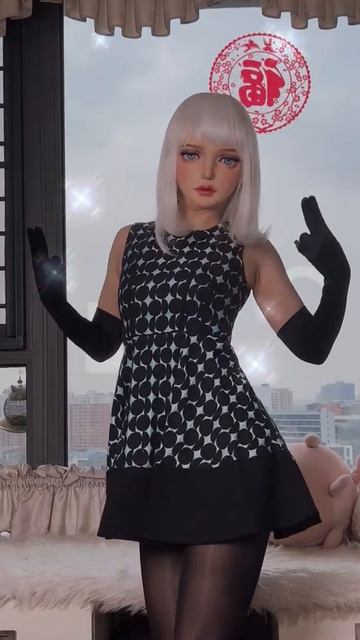 The elegant lady in kigurumi doll mask.