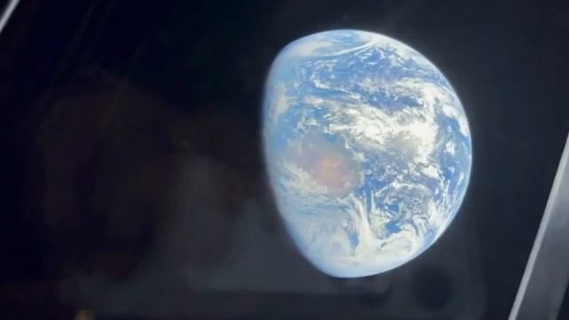 Вид на Землю из иллюминатора во время полета Артемида-2