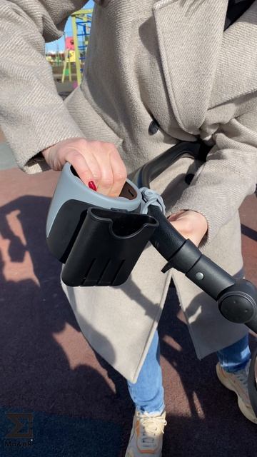 Подстаканник для коляски с отделением для телефона.