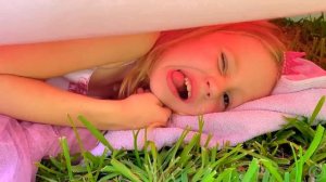 Nastya plays on a trampoline and has fun with her grandfather