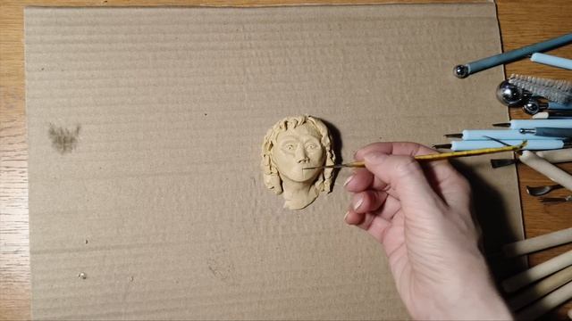 Барельеф головы.